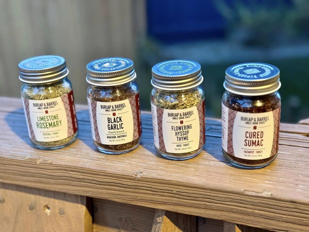 4 Burlap & Barrel Spices on a wooden slab