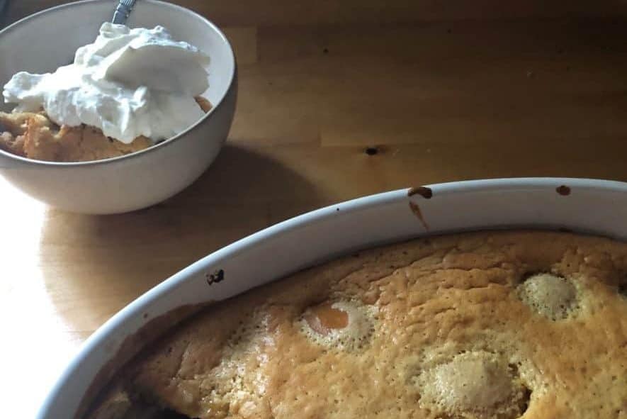 Overhead view of clafoutis with a scoop taken out