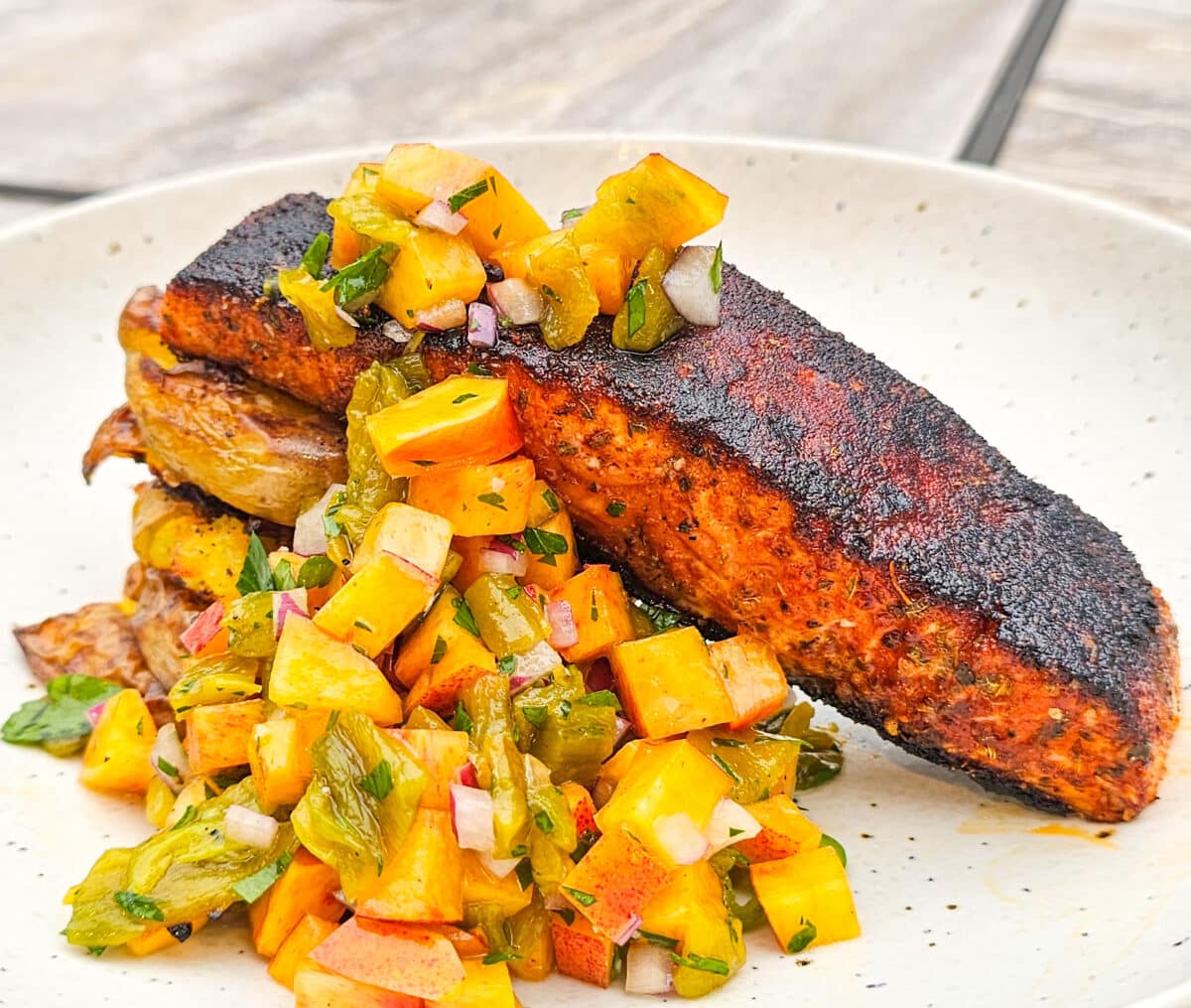 Blackened salmon with nectarine and hatch chili salsa