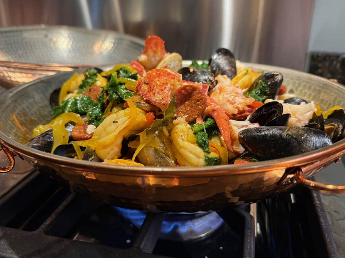 Dome shaped cataplana vessel is lined with tin.