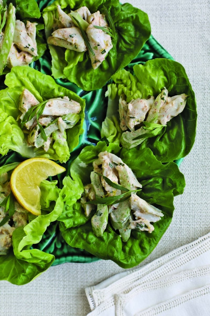 Freshly prepared crab & celery rémoulade wraps with a slice of lemon