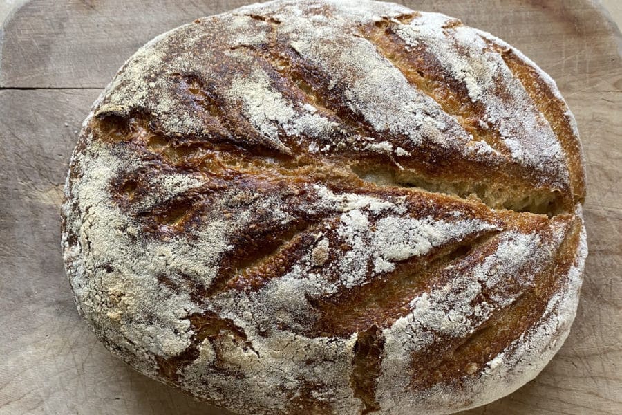 Close-up view of a crusty sourdough bread.