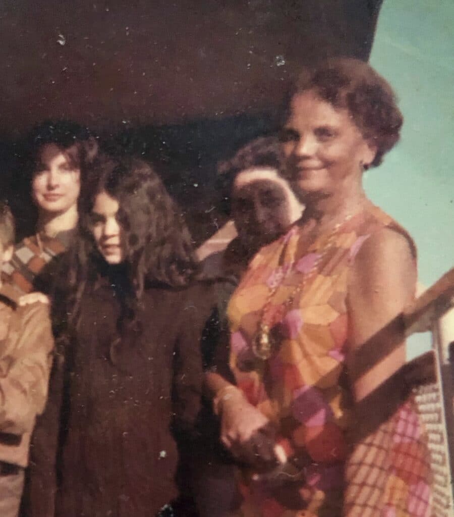 Evelyn Tillar on her apartment terrace with members of her family.