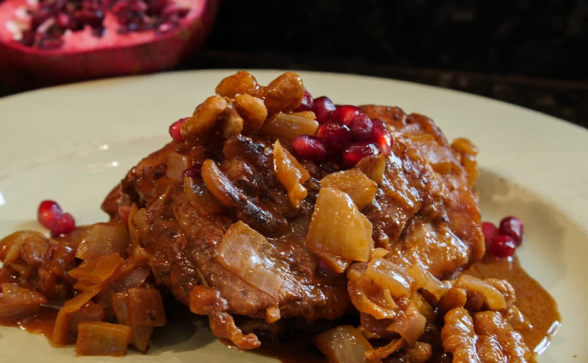 Authentic Fesenjan Persian chicken stew with pomegranate and walnut sauce.