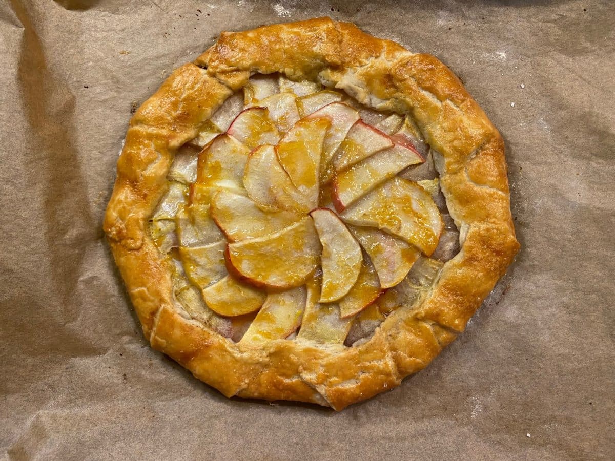 Baked apple galette with a beautiful arrangement of apple slices on top.