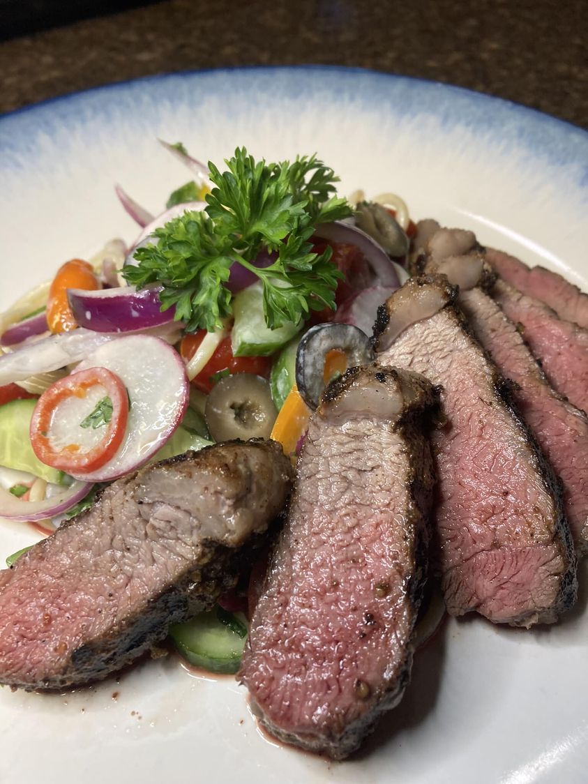 Grilled sirloin with fresh Mediterranean salad