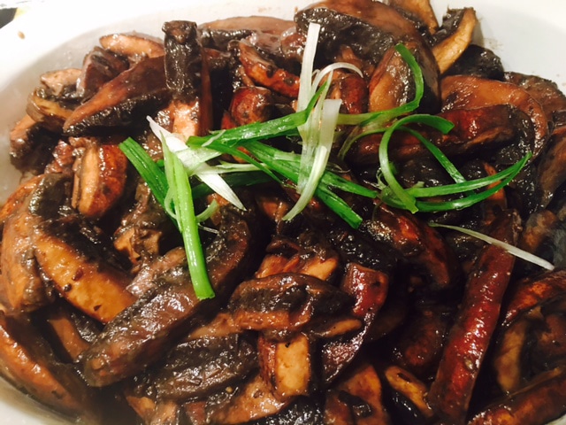 Close-up of miso butter portobello mushrooms with chili.