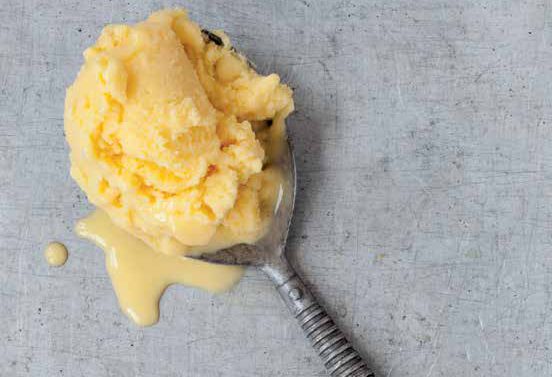 Close-up of pineapple mango vegan ice cream scoop