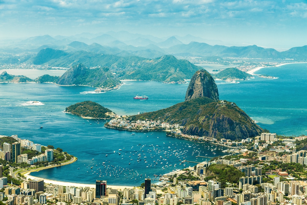 Aerial view of Rio de Janeiro with Sugarloaf Mountain and coastline.