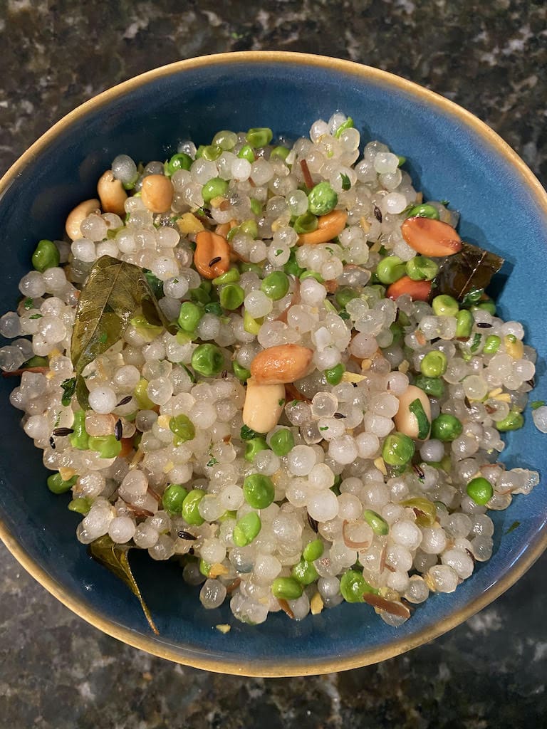 Bowl of Sabudana Kichri with peanuts and green peas