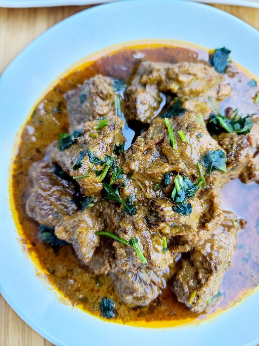 Dish of meat chunks in a rich masala curry sauce
