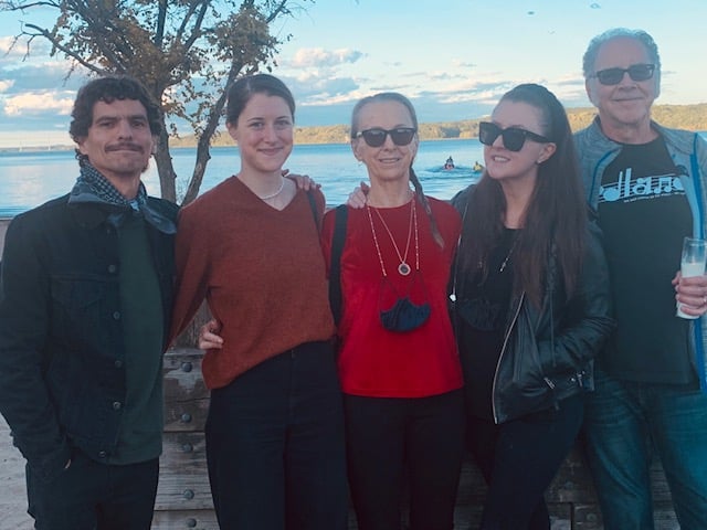 Group of friends, including the author on the far right, enjoying a moment by the sea.
