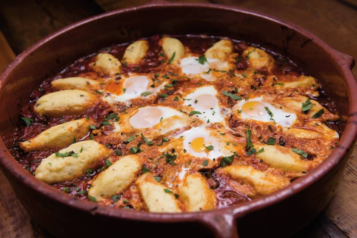 Shakshuka dish with duck eggs and semolina dumplings