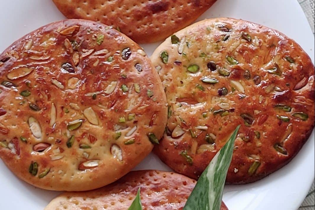 Close-up view of a sheermal saffron flatbread.