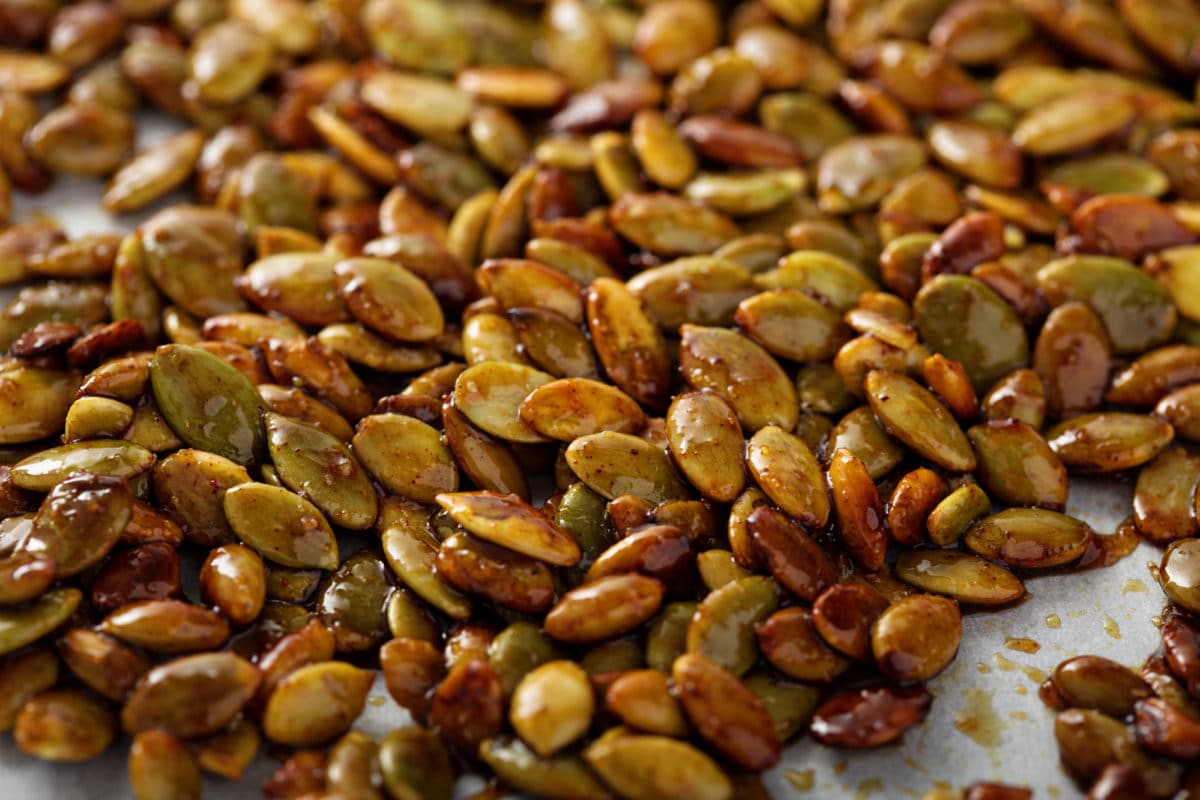 Roasted pumpkin seeds glazed with spices and brown sugar.