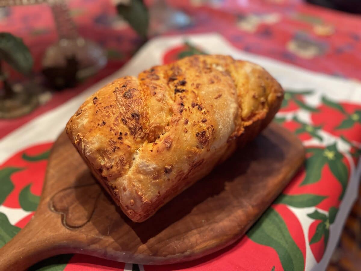 tomato cheese sourdough babka on a tomato patterned cloth
