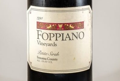 Close-up of a 1990 Foppiano Petite Sirah wine bottle label.