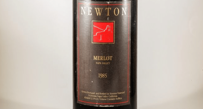 Close-up of a 1985 Newton Vineyard Merlot bottle label.