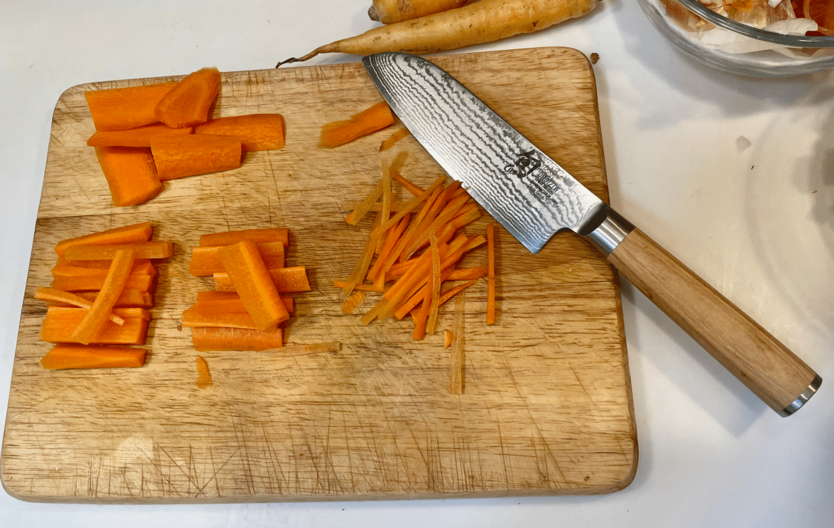 Cutting boards with carrot and various knife cuts