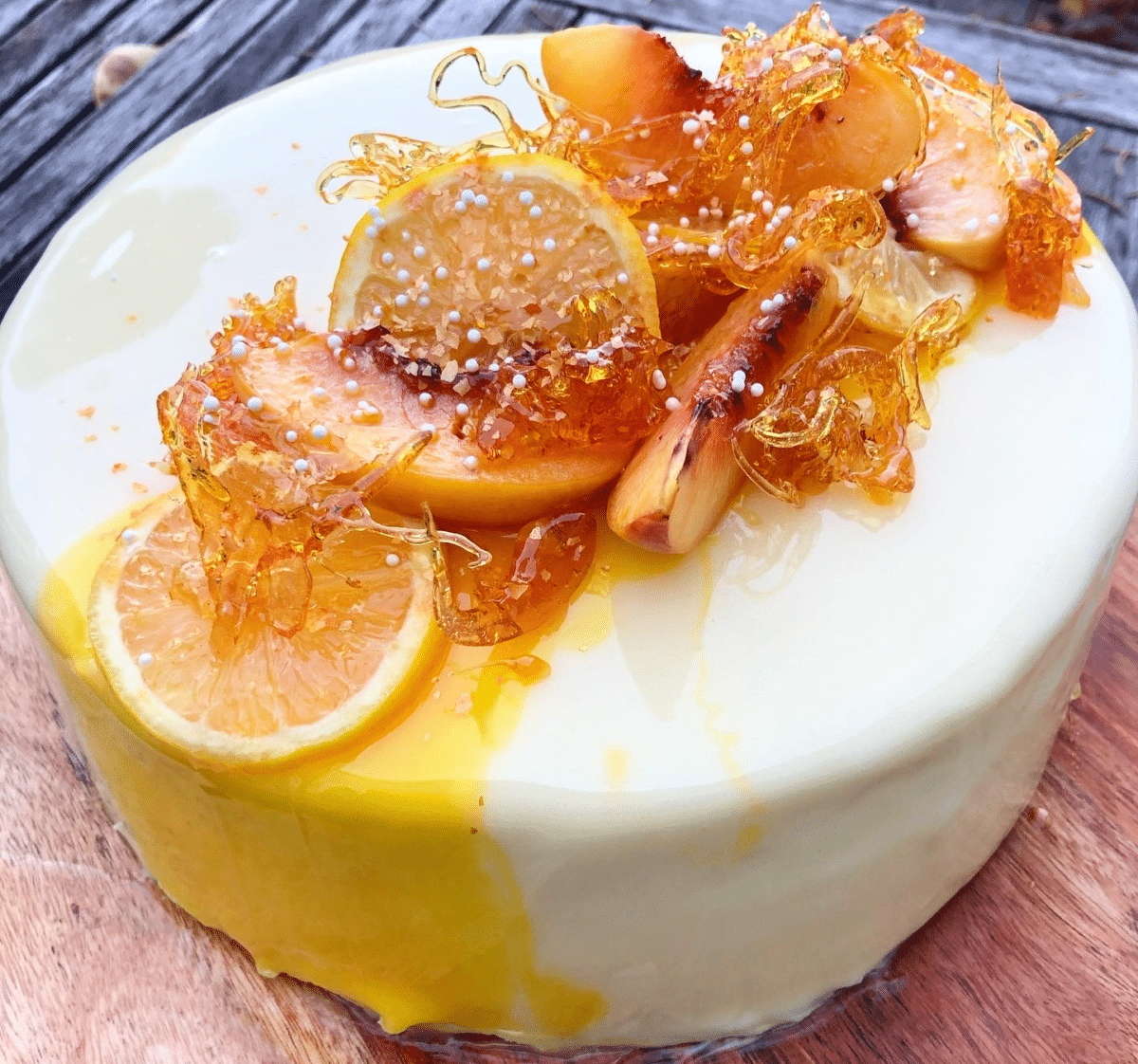Lemon Berry Glaze Cake with citrus and caramel toppings.