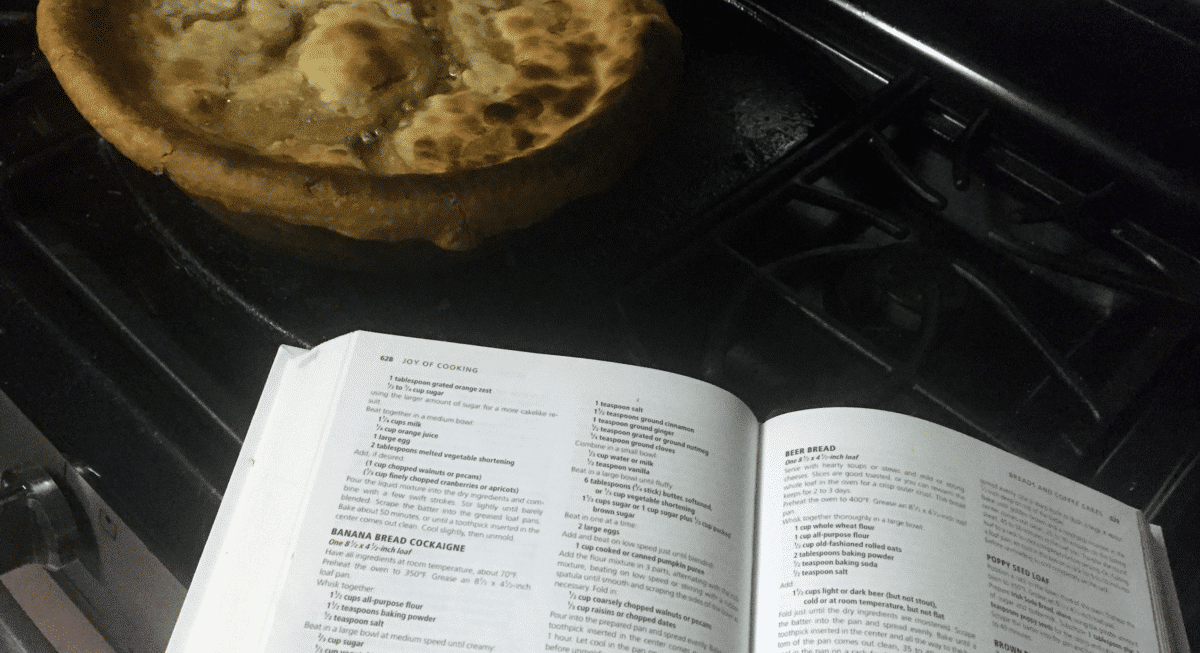 Open cookbook with text, signifying a recipe in process.