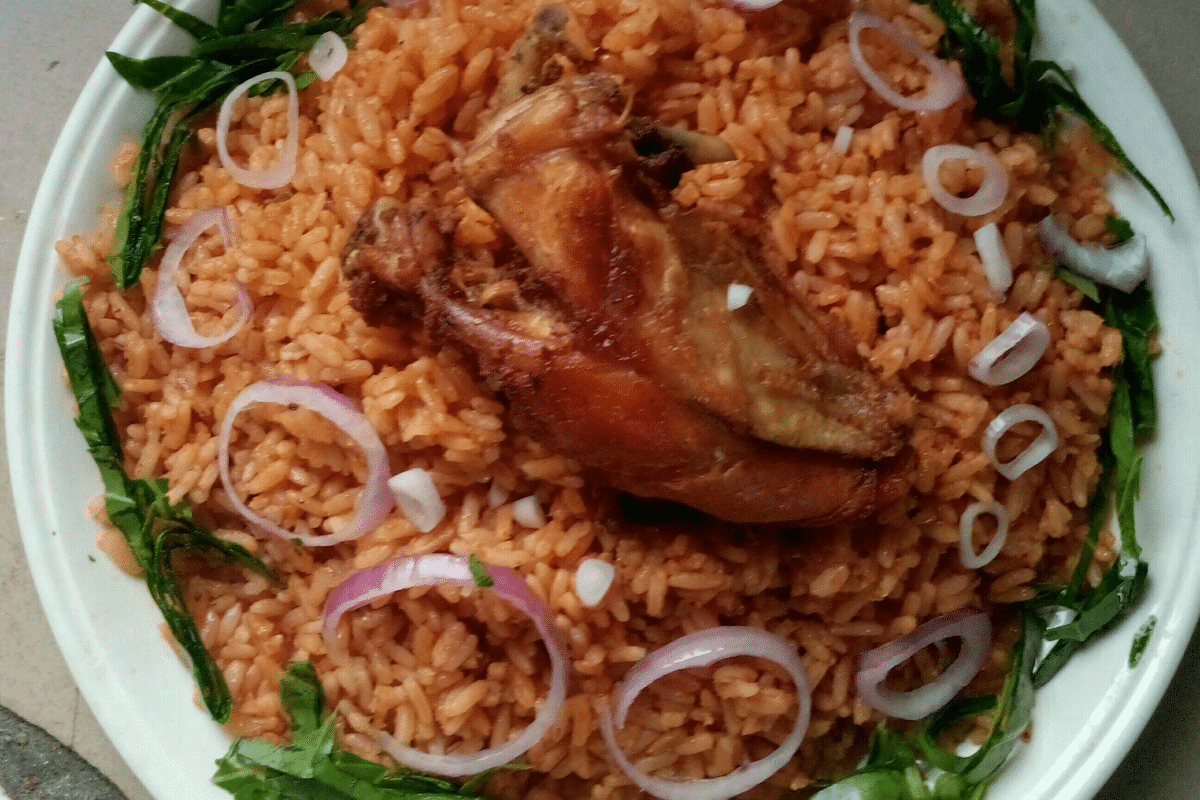 Plate of Jollof Rice with chicken and onions