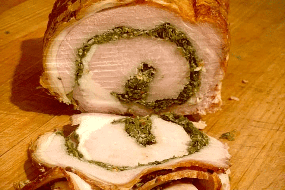Slices of stuffed Porchetta with a herb filling.