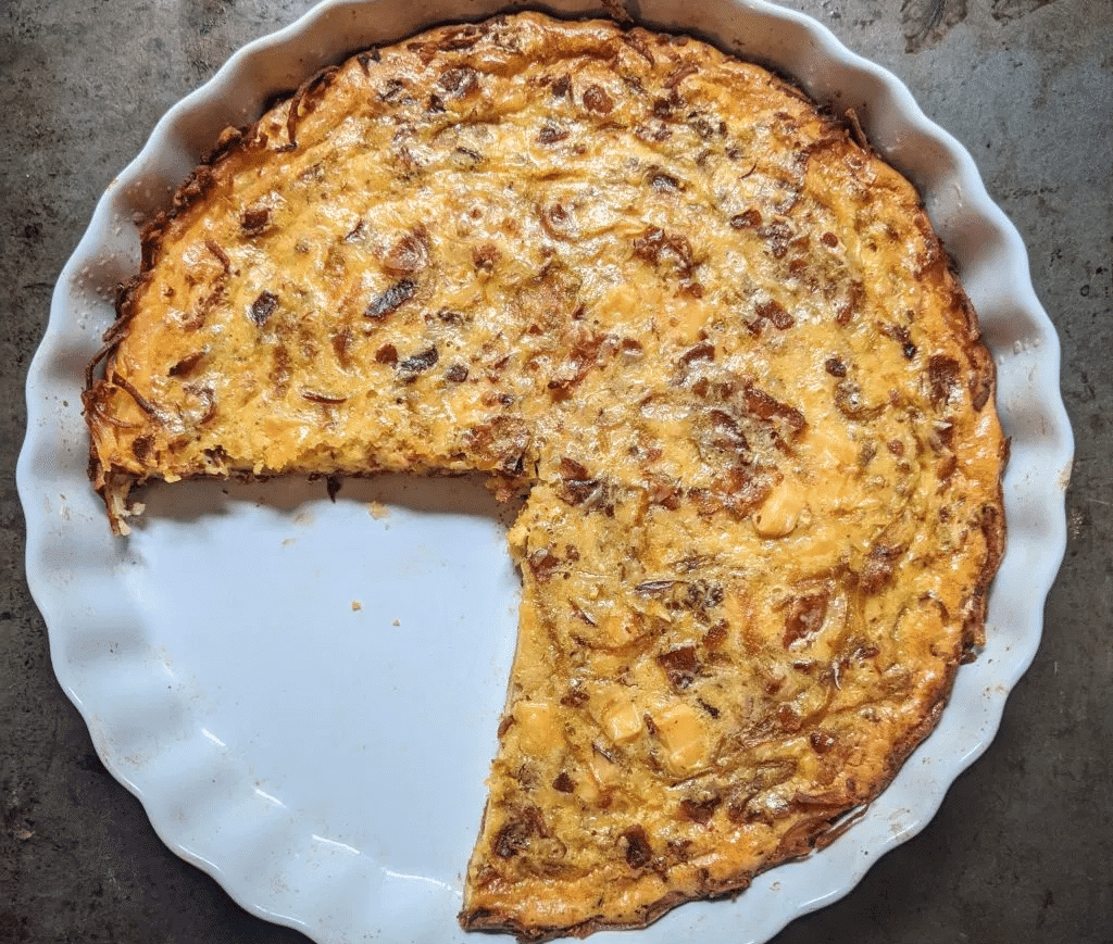 A delicious quiche with smoked gouda, bacon, and caramelized onions.